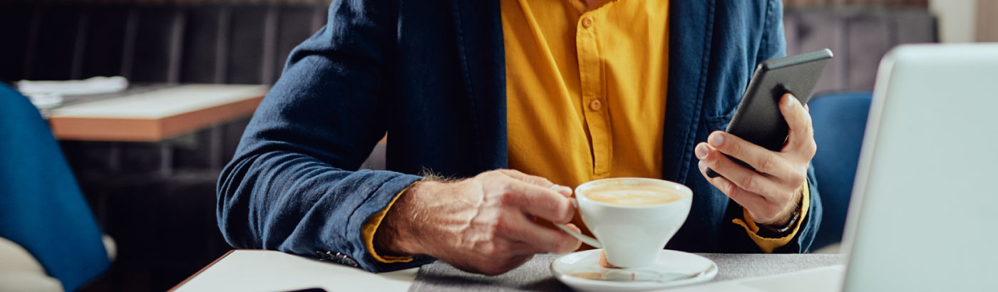 someone using smartphone in coffee shop